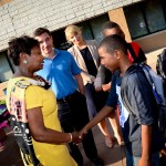 New York State Sen. Andrea Stewart-Cousins (D-Yonkers) greets children outside the Jackson Terrace Apartments in Yonkers last week as part of the "Backpack to School" drive